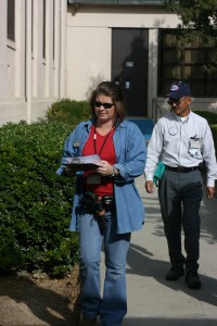 Image of the author inspecting the exterior of a school building